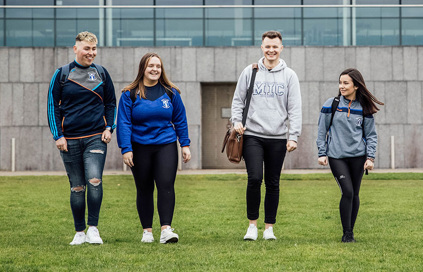 Four students walking on MIC Limerick campus