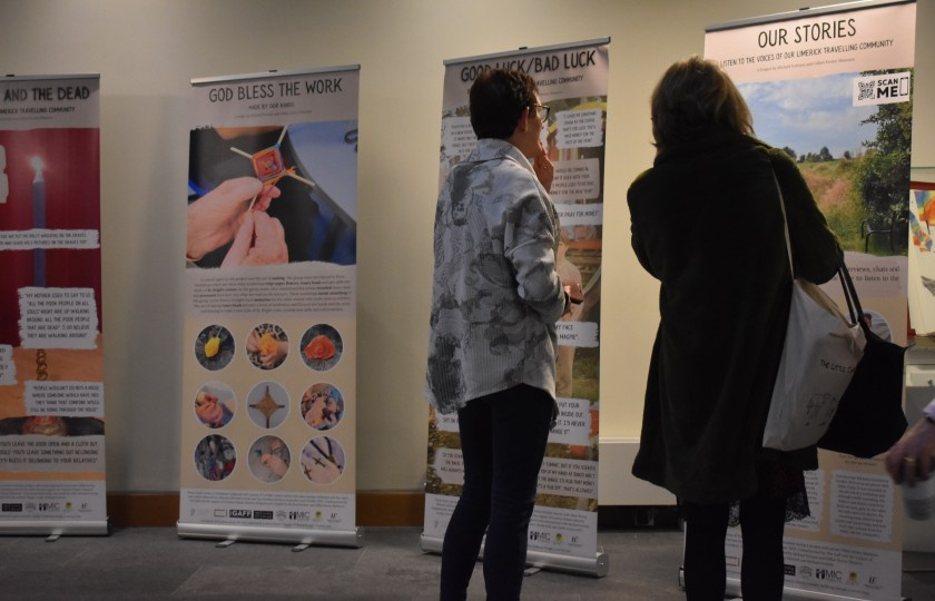 Two women looking at the exhibition materials