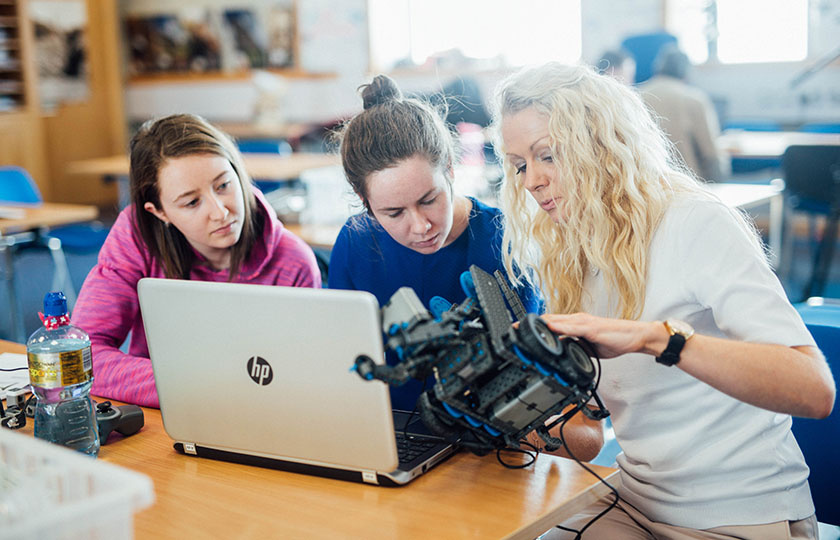 Two girls taking part in a VEX Robotics Training Workshop at Mary Immaculate College 