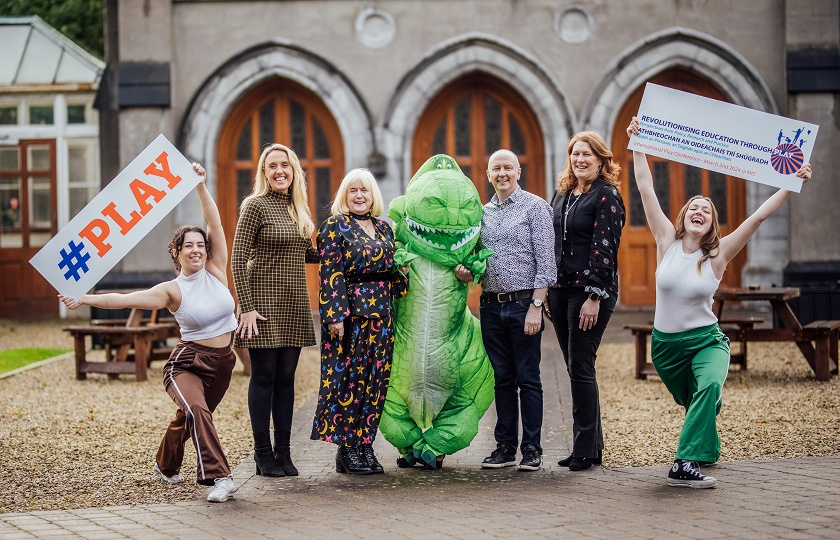 ‘Revolutionising Education Through Play’ Conference organising committee in MIC Limerick Quad with T-Rex and dancers