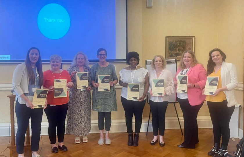 Group of MIC staff holding certificates of training course