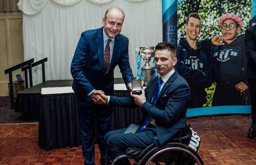 Tánaiste Micheál Martin presents Jamie Wall with his Medal