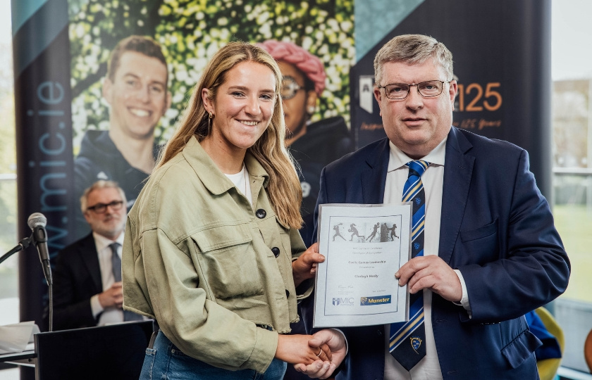 Clodagh Healy and Ger Ryan holding a certificate