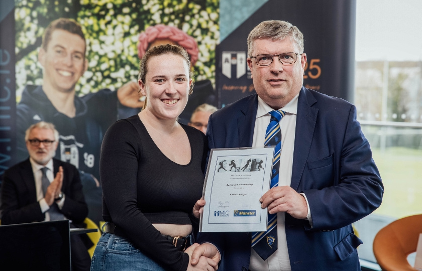 Katie Lonergan and Ger Ryan holding a certificate