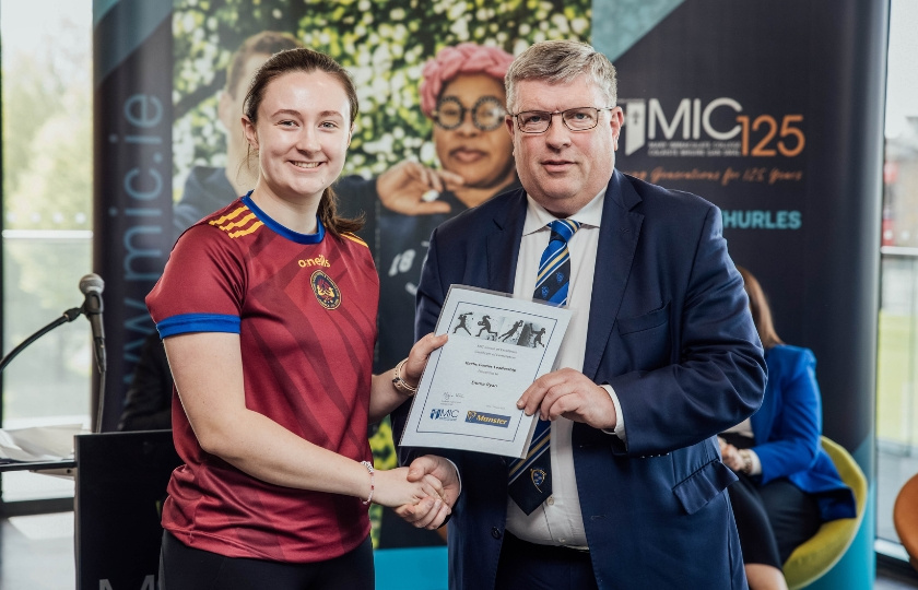 Emma Ryan and Ger Ryan holding a certificate