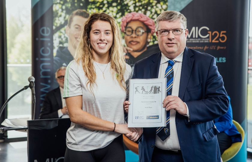 Sarah Ryan and Ger Ryan holding a certificate