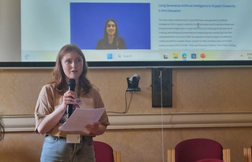 Photo of Aisling Knox, MISU President, introducing the latest case studies