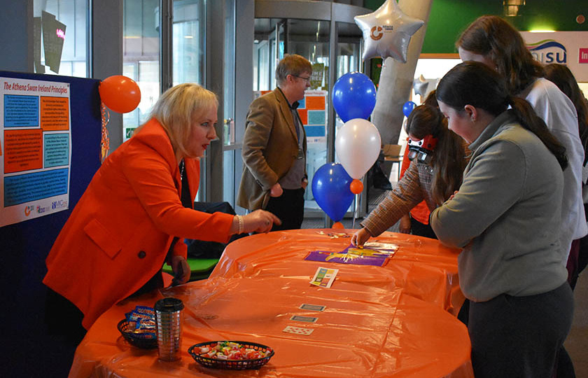 MIC staff member interacting with students at the Athena Swan Student Fair 2025, MIC Limerick campus