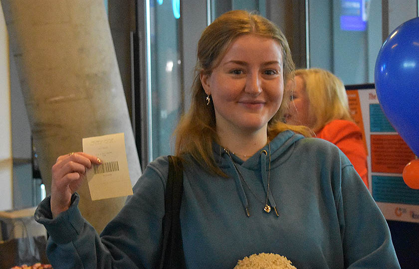 Student holding up winning ticket at the Athena Swan Student Fair 2025, MIC Limerick campus