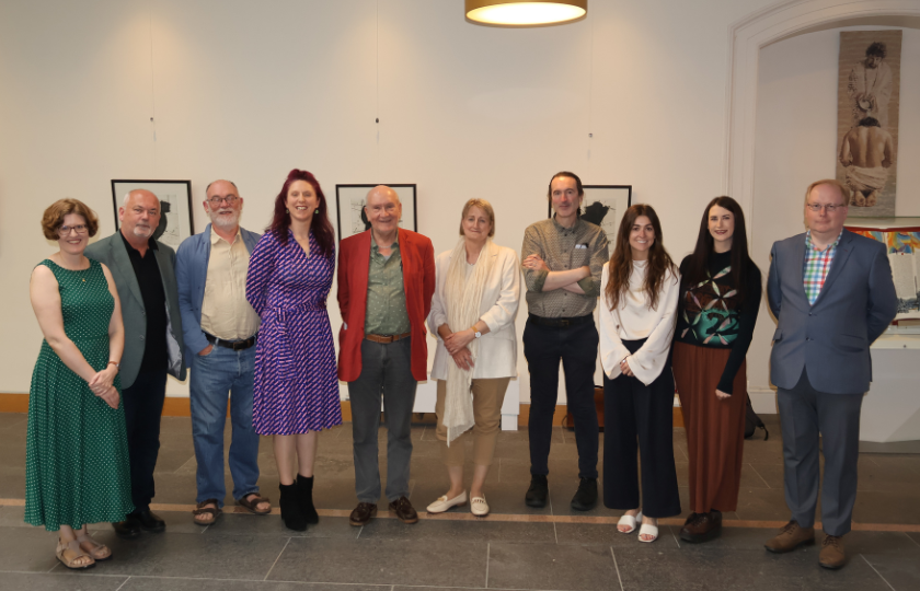 A group of people posing for a picture to celebrate Comhdháil na Bealtaine 2025