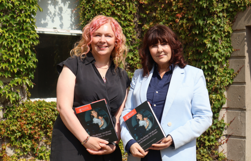 Dr Deirdre Flynn and Dr Susan Liddy holding a copy of their book