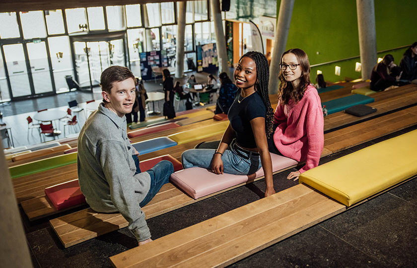 Students sitting on the steps in the TARA building