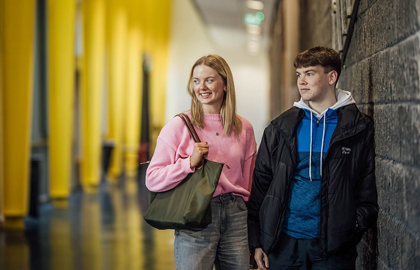 Two students standing in An tSlí at MIC