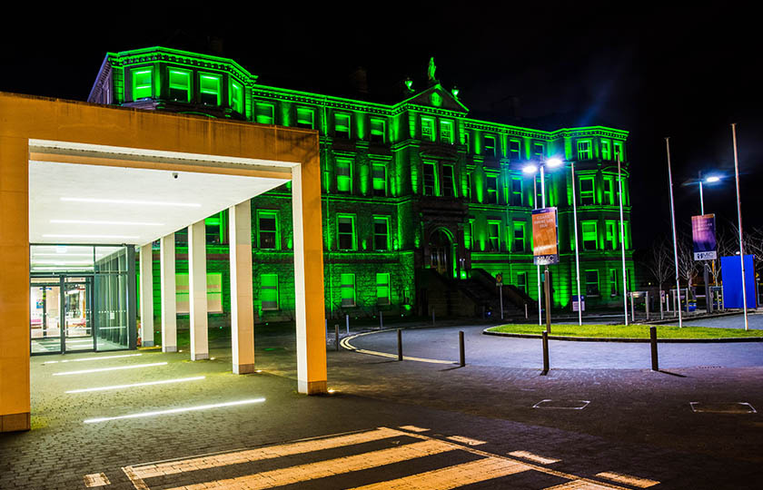 Foundation Building, Mary Immaculate College lit up in green at night for St Patrick's Day