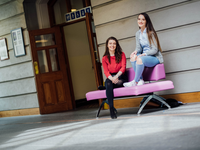 Two MIC students sitting in the lounge