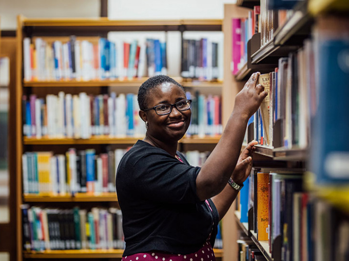 Student in MIC library looking towards camera