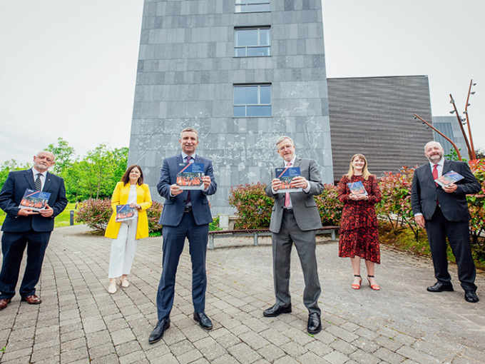 Prof. James Deegan, Professor Niamh Hourigan, Niall Collins TD, Professor Eugene Wall, Dr Julianne Stack and Prof Michael Healy standing in front of TARA building in MIC.