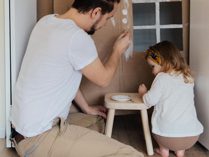 Parent and child playing