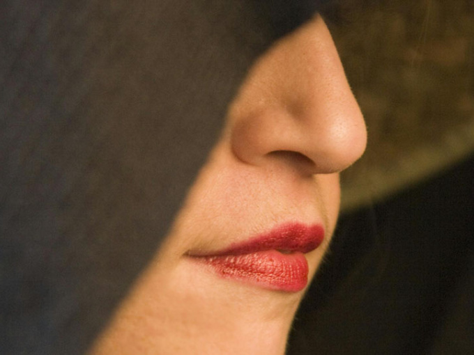 Close-up of Woman Wearing Red Lipstick